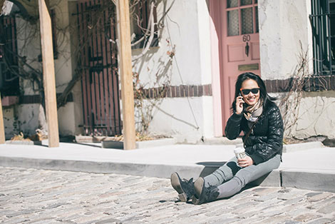 a woman sitting in the street