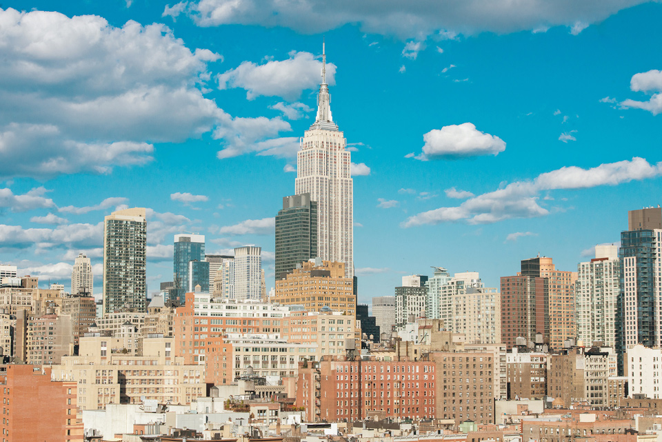 Chelsea around the block of NYC with blue sky above