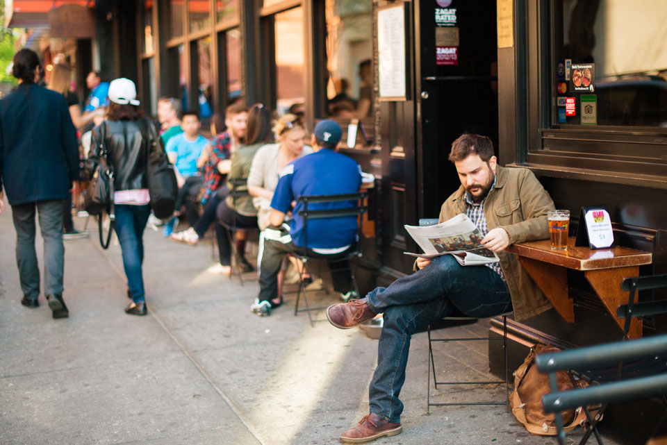 a guy reading a news paper